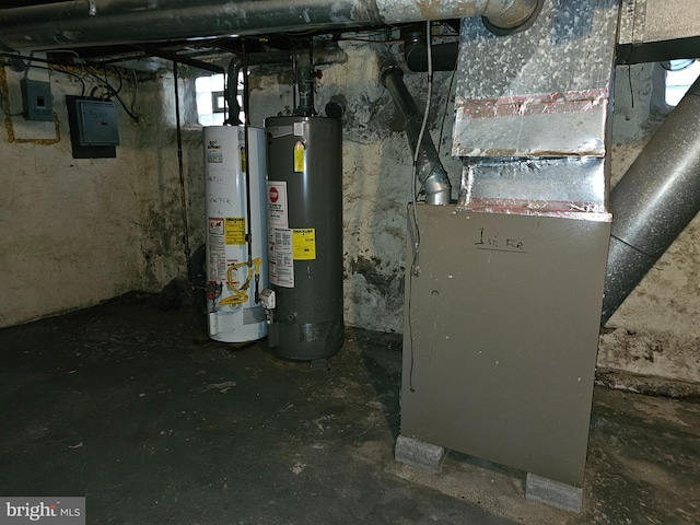 utility room featuring water heater, electric panel, heating unit, and gas water heater