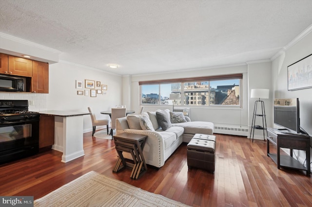 living room with a baseboard heating unit, dark wood-type flooring, ornamental molding, and a textured ceiling