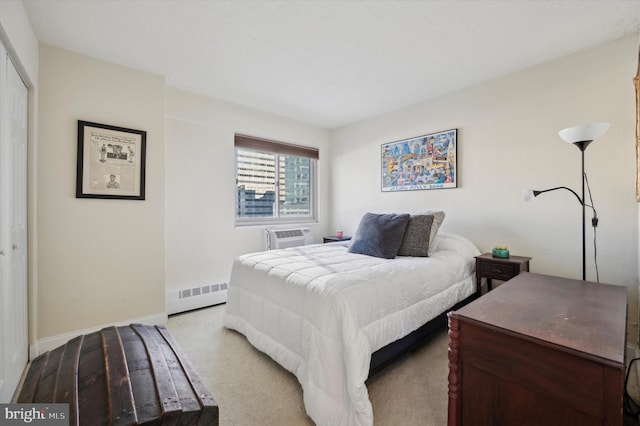 carpeted bedroom featuring an AC wall unit and a closet