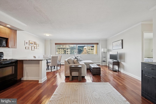 living room featuring dark wood-type flooring, a textured ceiling, and crown molding