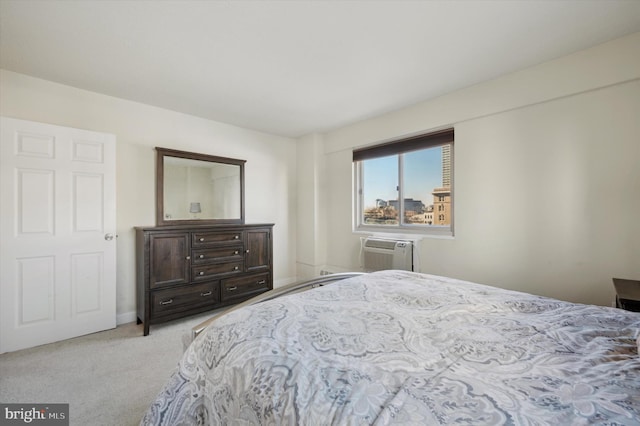 bedroom featuring light carpet and a wall mounted AC