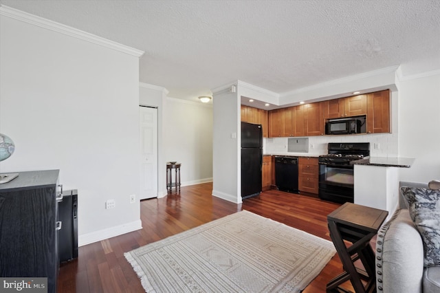 kitchen with a textured ceiling, dark hardwood / wood-style floors, black appliances, and crown molding