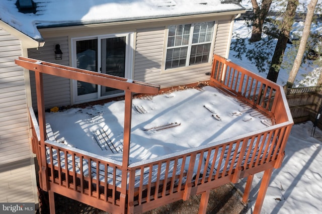 view of snow covered deck