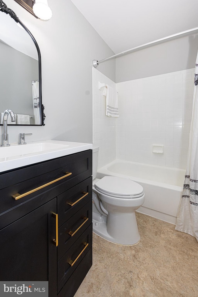 full bathroom with vanity, shower / bath combination with curtain, and toilet