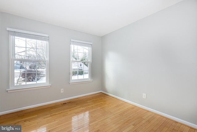 empty room with light wood-type flooring