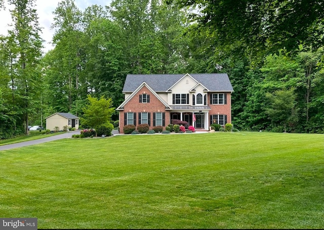 colonial house featuring a front lawn and a porch