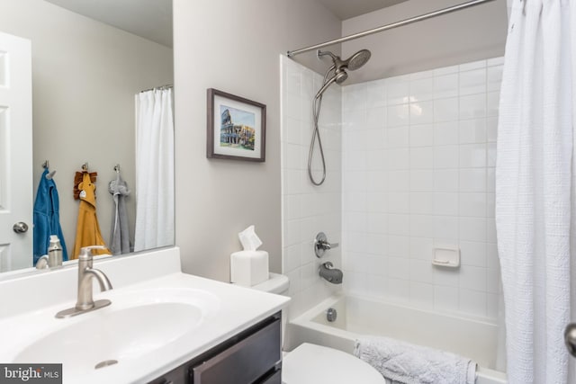 full bathroom featuring toilet, vanity, and shower / tub combo with curtain