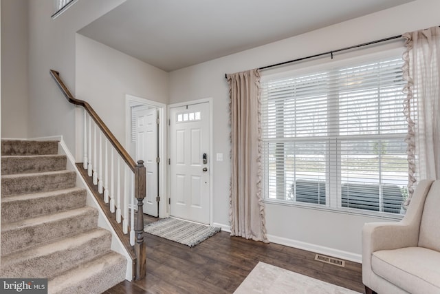 entrance foyer featuring dark hardwood / wood-style flooring