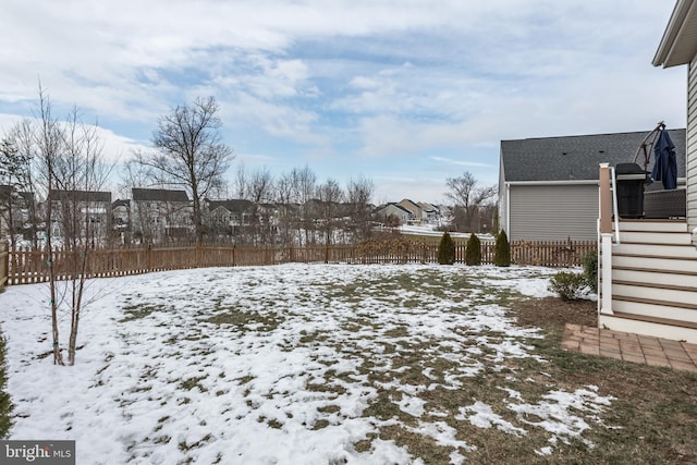 view of yard layered in snow