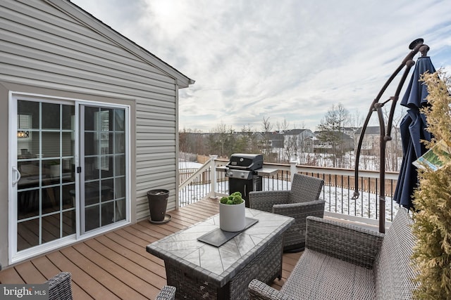 snow covered deck with grilling area