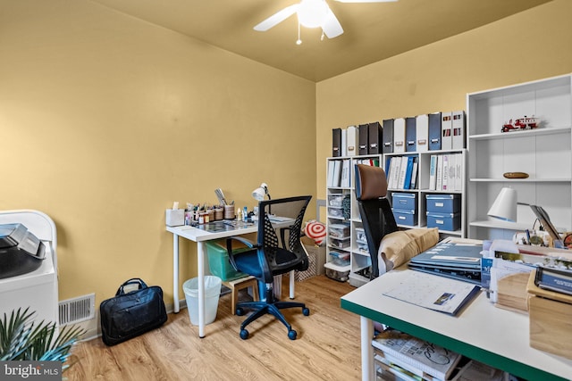 office space featuring light wood-type flooring and ceiling fan