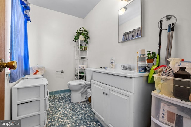 bathroom featuring toilet and vanity