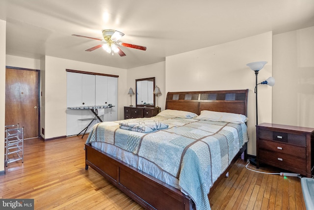 bedroom with ceiling fan and light hardwood / wood-style flooring