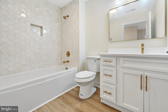 116 Holly Hill Ct, Fruitland, MD 21826 - full bath featuring vanity, visible vents, toilet, wood finished floors, and washtub / shower combination