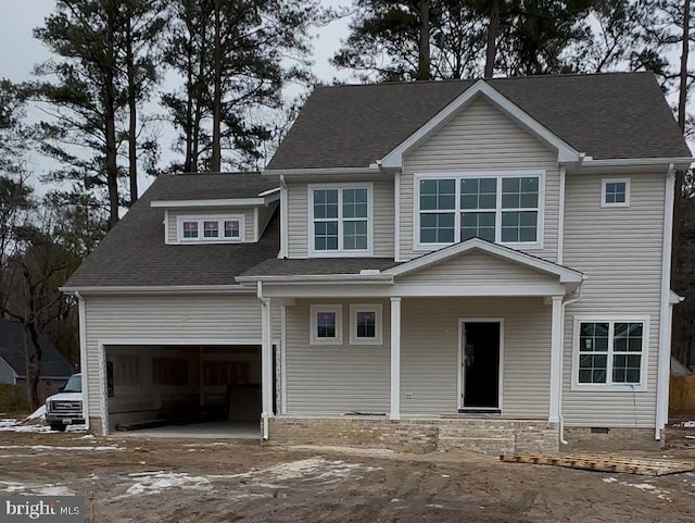 view of front of property with a garage and covered porch