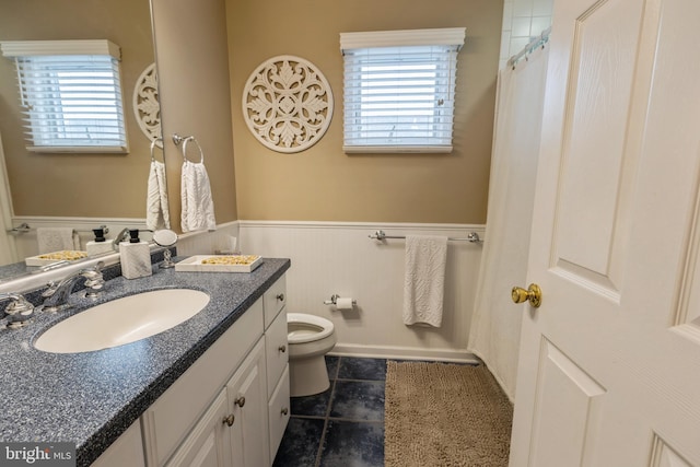 bathroom featuring toilet and vanity