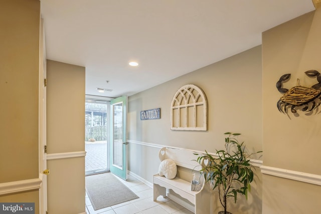 doorway to outside featuring light tile patterned floors