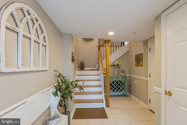 staircase with tile patterned floors