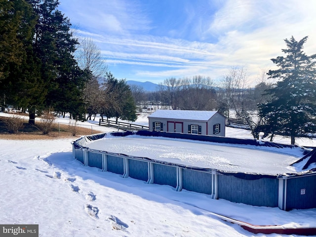 snow covered property with a mountain view