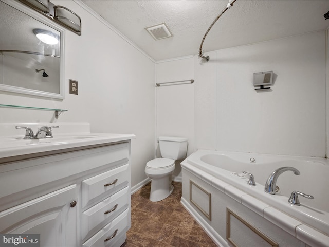 bathroom featuring toilet, a textured ceiling, ornamental molding, a bath, and vanity