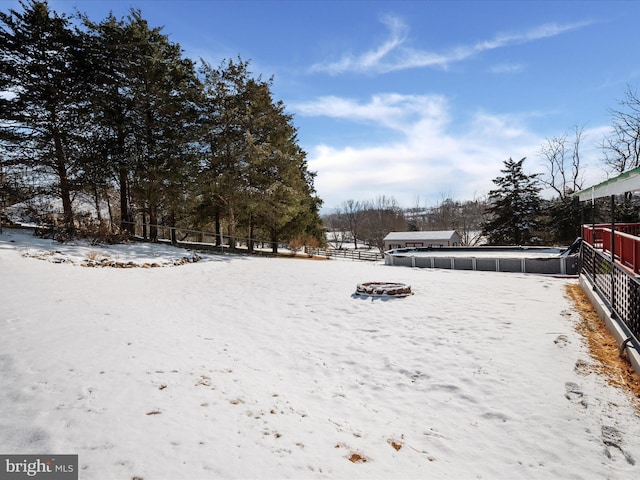 view of yard layered in snow