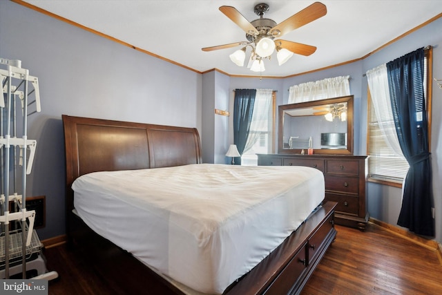 bedroom with ceiling fan, dark wood-type flooring, and crown molding