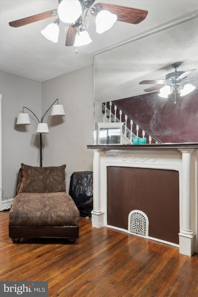 sitting room featuring dark hardwood / wood-style floors