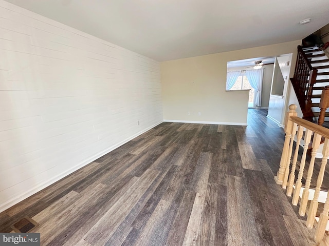 empty room with dark hardwood / wood-style floors