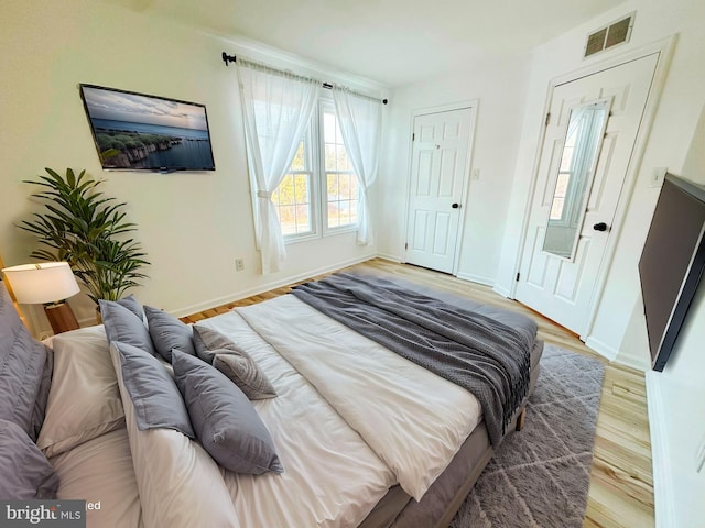 bedroom featuring wood-type flooring