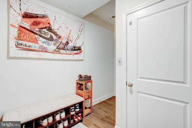 hallway with light wood-type flooring