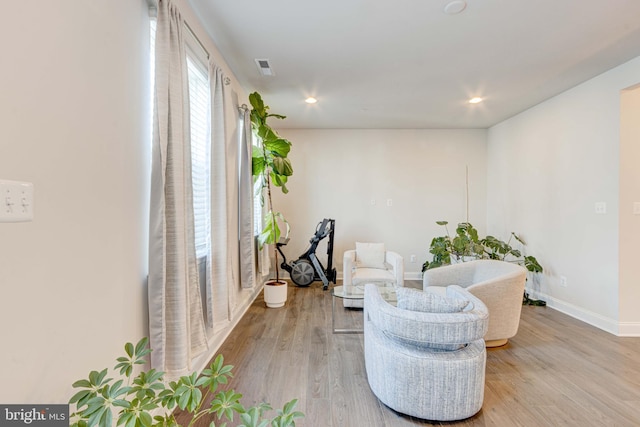 sitting room featuring light hardwood / wood-style flooring