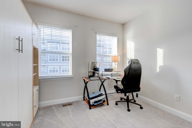 office area with light colored carpet