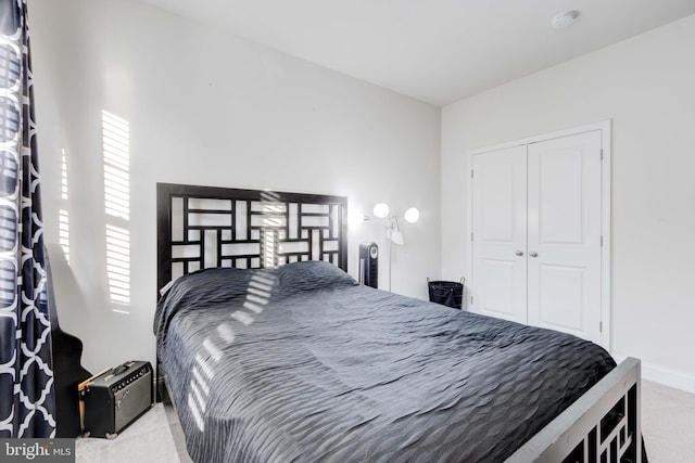 carpeted bedroom with a closet