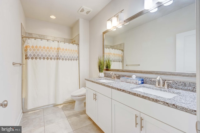 bathroom with tile patterned flooring, vanity, a shower with shower curtain, and toilet