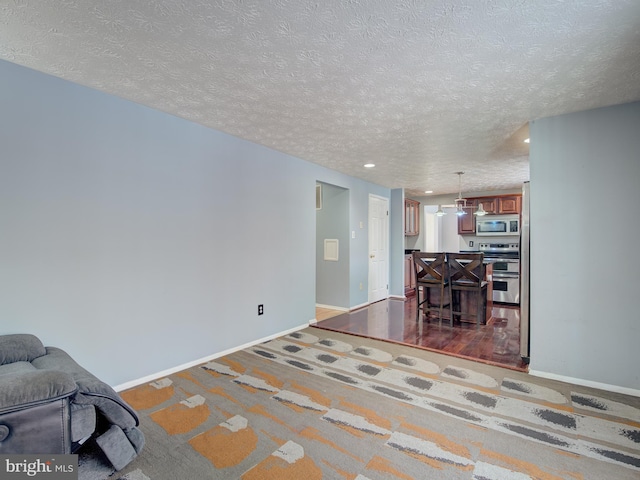 living room with a textured ceiling