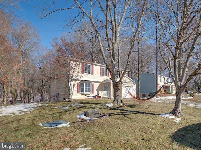 colonial home with a front yard