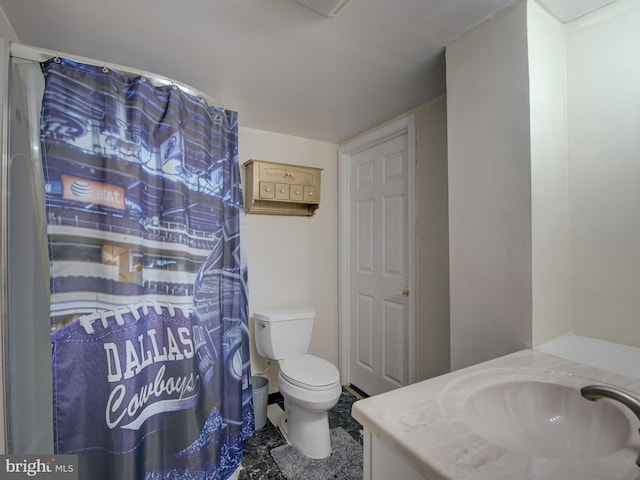 bathroom featuring vanity and toilet