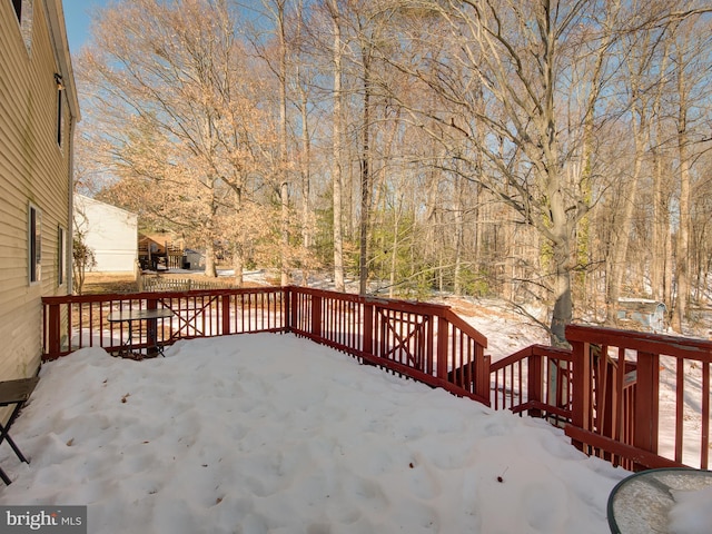 view of snow covered deck