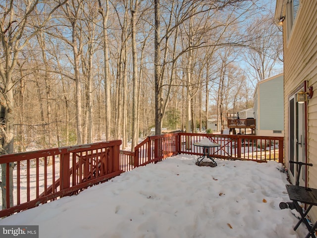 view of snow covered deck