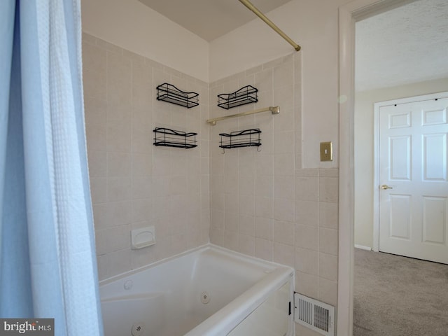 bathroom with shower / tub combo with curtain