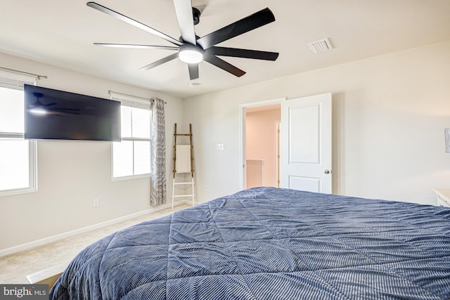 bedroom featuring a ceiling fan, carpet, visible vents, and baseboards