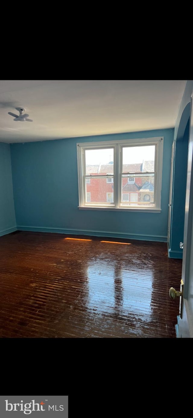 empty room featuring dark wood-type flooring