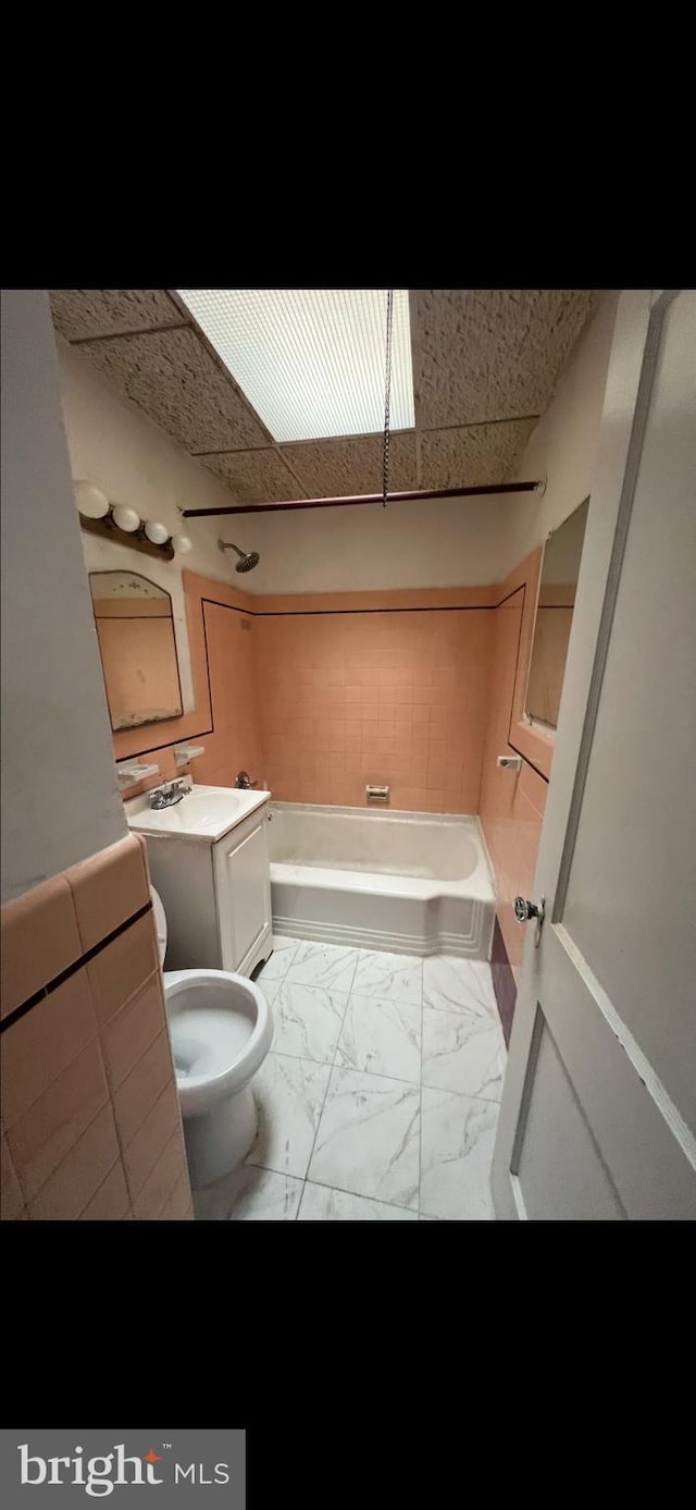 full bathroom featuring toilet, shower / bath combination, and vanity