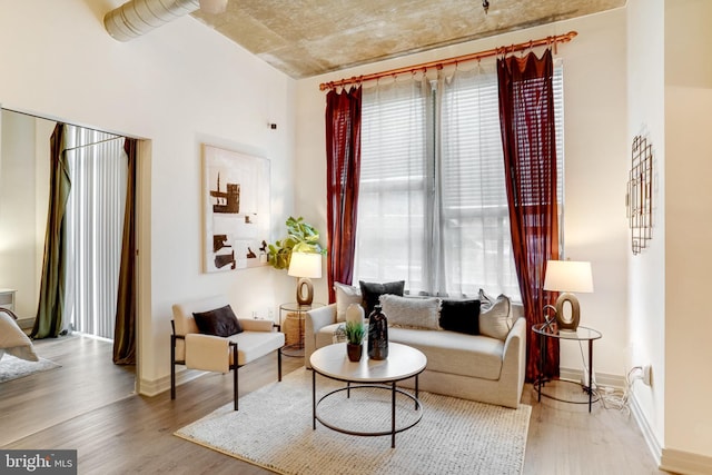 sitting room with hardwood / wood-style floors