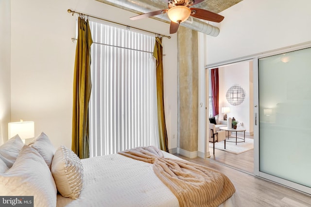 bedroom featuring ceiling fan, a closet, and light hardwood / wood-style flooring