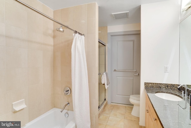 full bathroom featuring toilet, tile patterned floors, vanity, and shower / bath combo with shower curtain