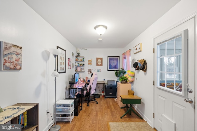 office area with light hardwood / wood-style flooring