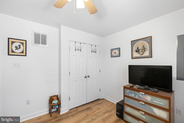 bedroom featuring a closet, ceiling fan, and light wood-type flooring