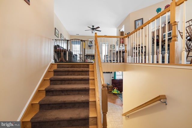 stairway with ceiling fan