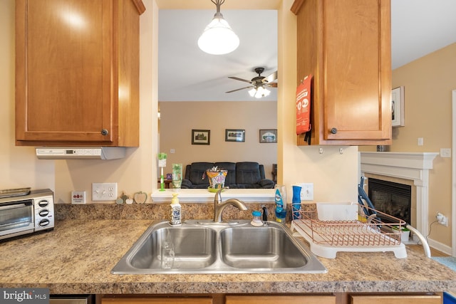 kitchen featuring sink and ceiling fan